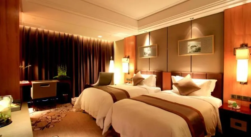 Bed in Zhangjiagang Zhonglian GDH International Hotel