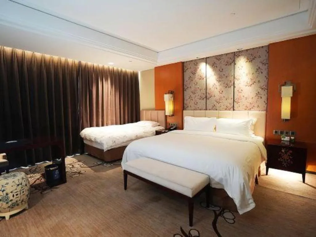 Bed in Zhangjiagang Zhonglian GDH International Hotel