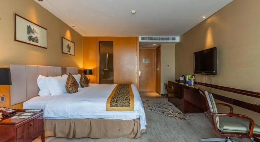 Bed in Zhangjiagang Zhonglian GDH International Hotel