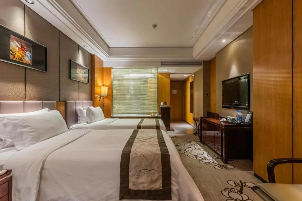 Bed in Zhangjiagang Zhonglian GDH International Hotel