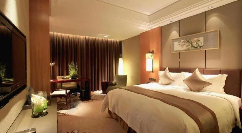 Bed in Zhangjiagang Zhonglian GDH International Hotel