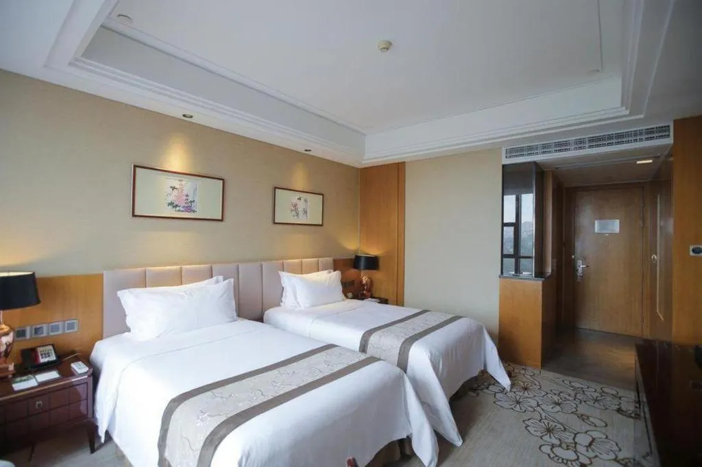 Bed in Zhangjiagang Zhonglian GDH International Hotel