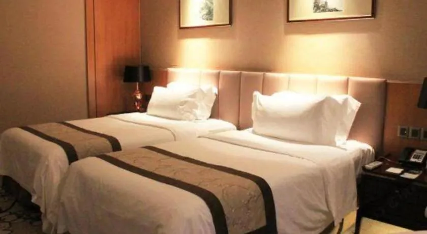 Bed in Zhangjiagang Zhonglian GDH International Hotel