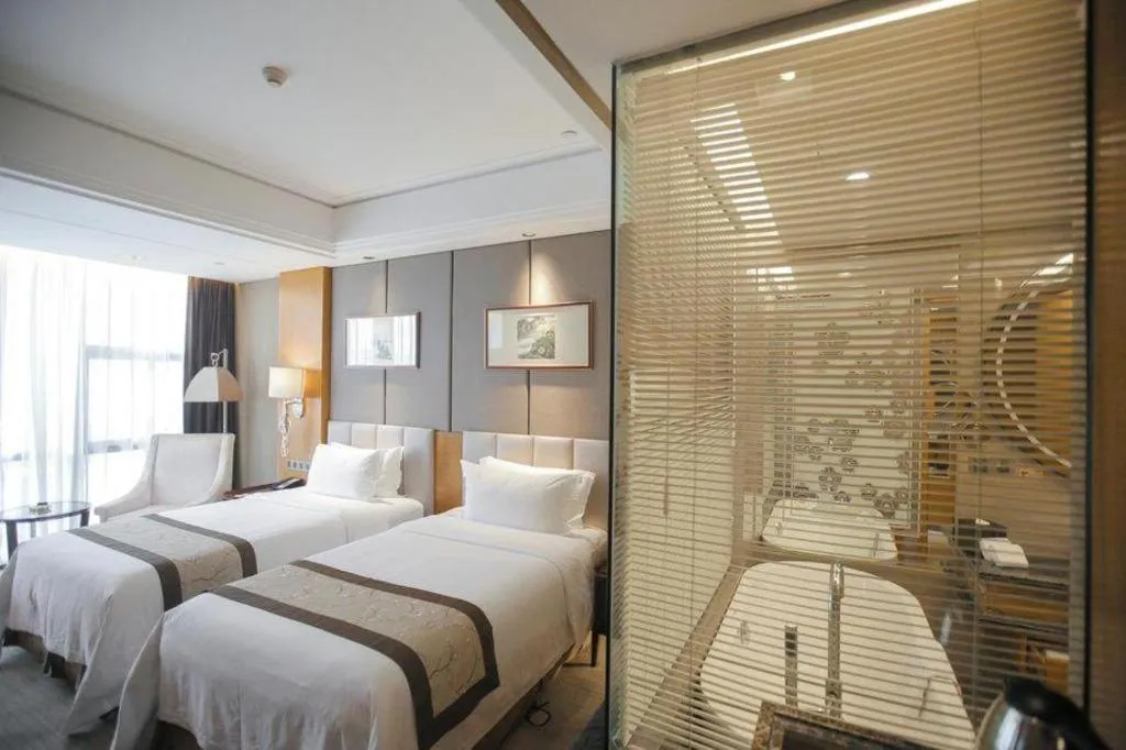 Bed in Zhangjiagang Zhonglian GDH International Hotel