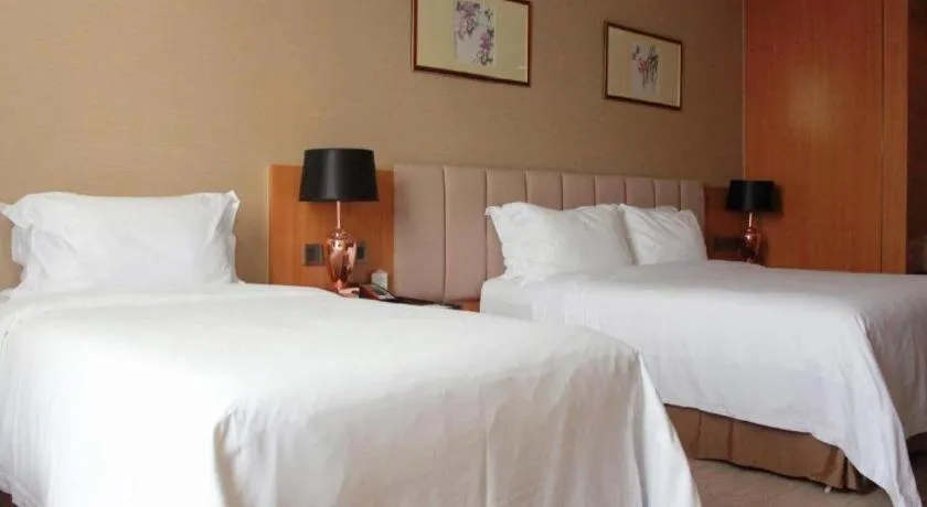 Bed in Zhangjiagang Zhonglian GDH International Hotel