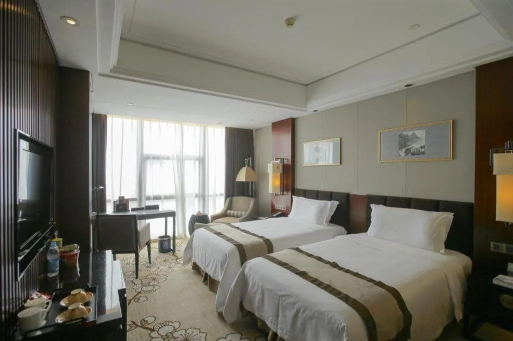 Bed in Zhangjiagang Zhonglian GDH International Hotel