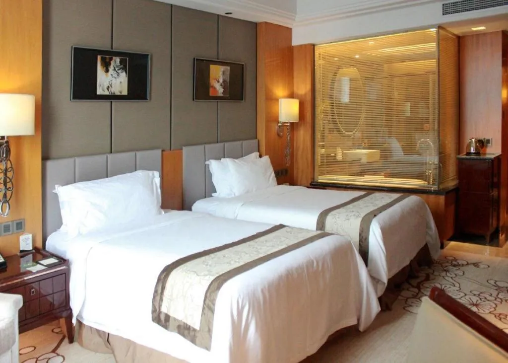 Bed in Zhangjiagang Zhonglian GDH International Hotel