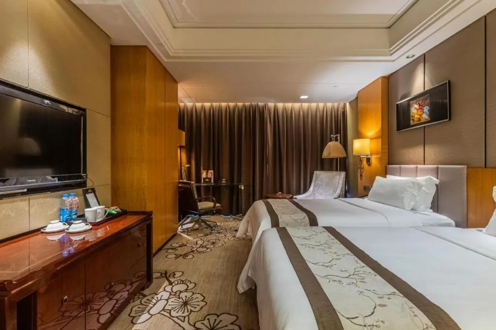 Bed in Zhangjiagang Zhonglian GDH International Hotel