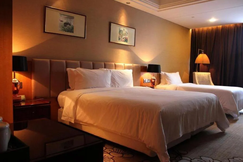 Bed in Zhangjiagang Zhonglian GDH International Hotel