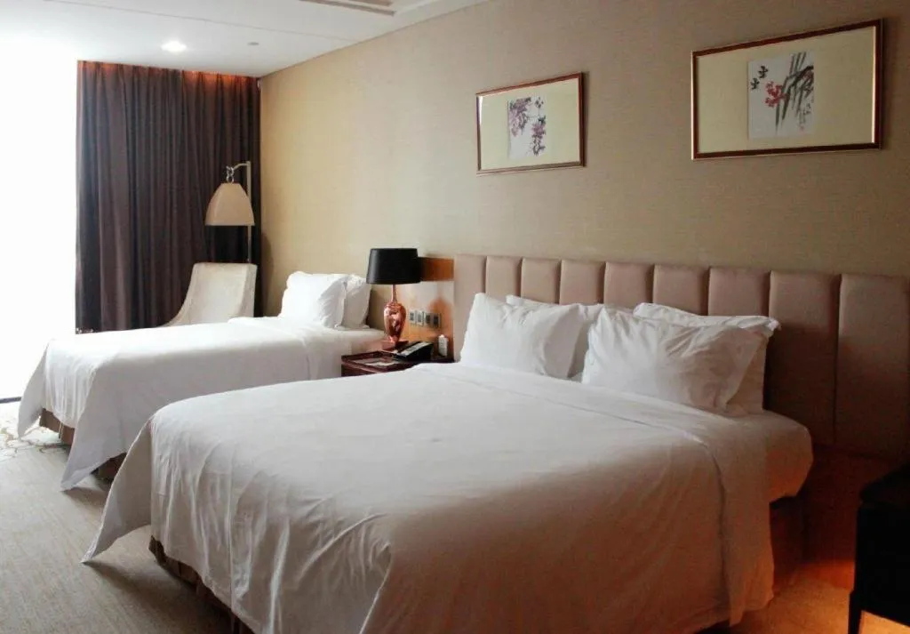 Bed in Zhangjiagang Zhonglian GDH International Hotel