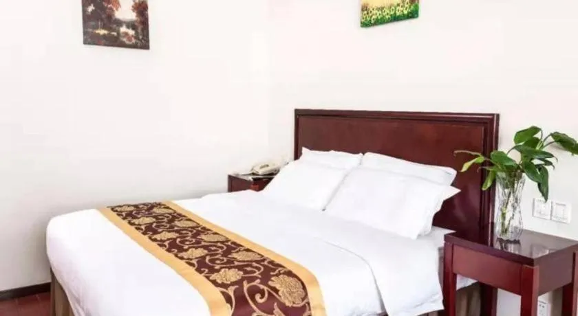 Bed in GreenTree Inn Shanghai Changxing Island Yuansha Fishing Port Hotel