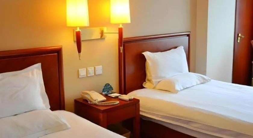 Bed in GreenTree Inn Shanghai Changxing Island Yuansha Fishing Port Hotel