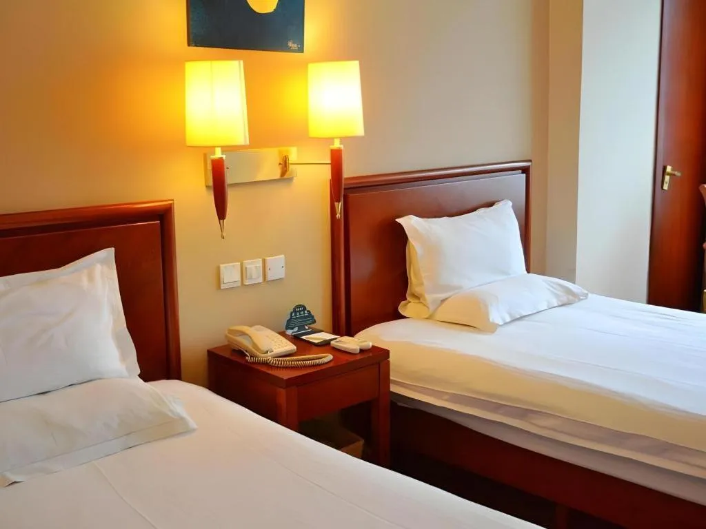Bed in GreenTree Inn Shanghai Changxing Island Yuansha Fishing Port Hotel