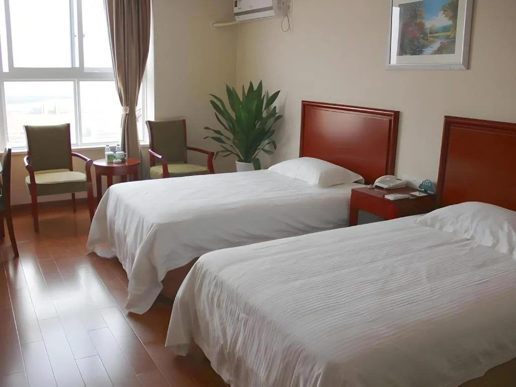 Bed in GreenTree Inn Shanghai Changxing Island Yuansha Fishing Port Hotel
