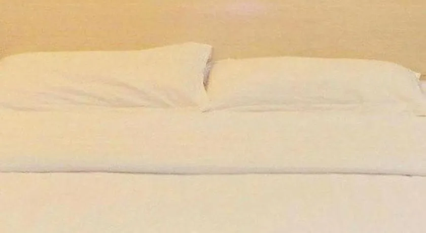 Bed in GreenTree Inn Shanghai Changxing Island Yuansha Fishing Port Hotel