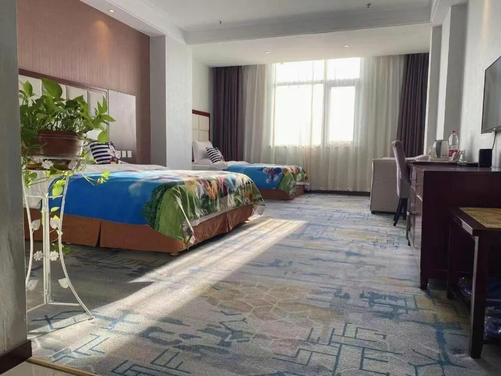 Bed in Xinxiang Zhongzhou Yihe Hotel