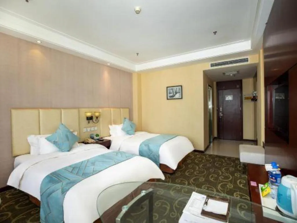 Bed in Xinxiang Zhongzhou Yihe Hotel