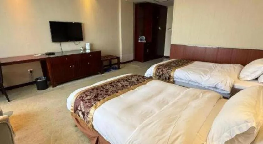 Bed in Xinxiang Zhongzhou Yihe Hotel