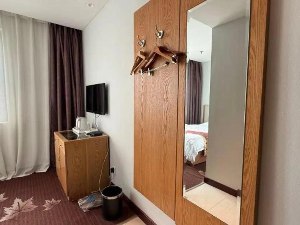 Bed in Xinxiang Zhongzhou Yihe Hotel