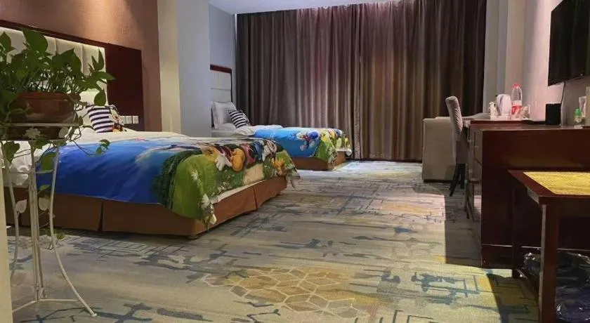 Bed in Xinxiang Zhongzhou Yihe Hotel