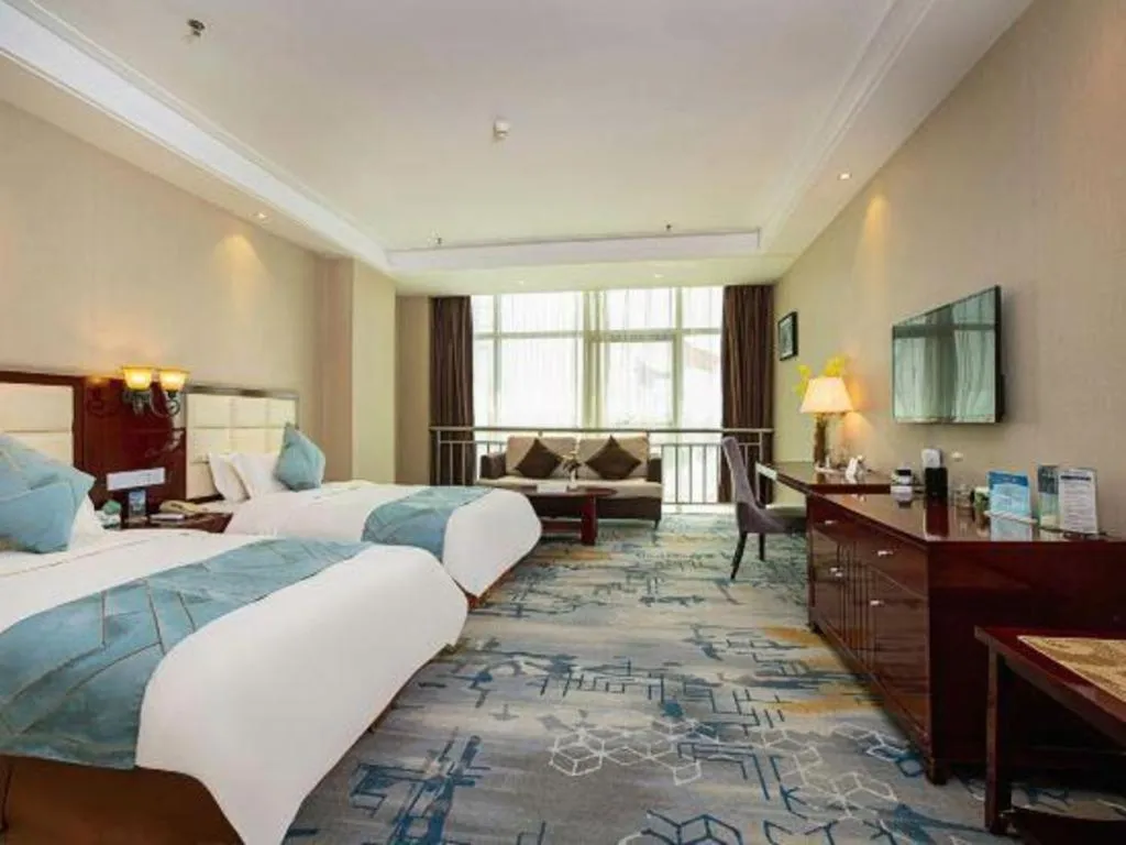 Bed in Xinxiang Zhongzhou Yihe Hotel