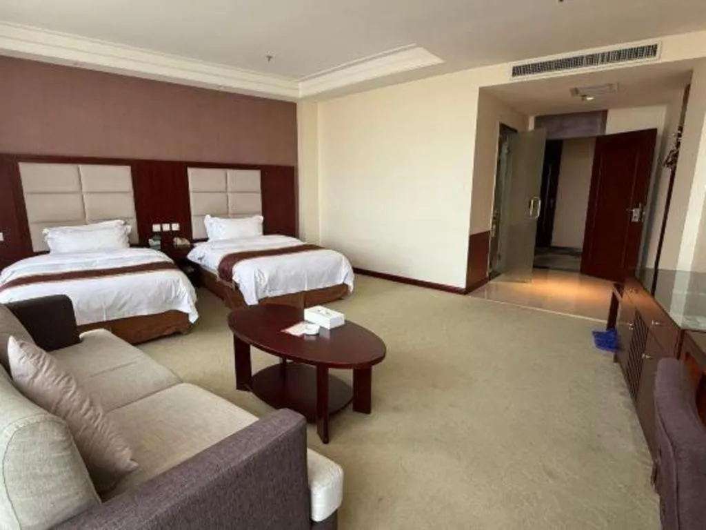 Bed in Xinxiang Zhongzhou Yihe Hotel