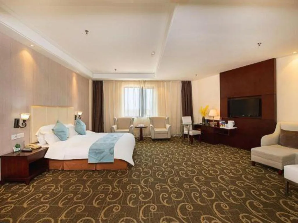 Bed in Xinxiang Zhongzhou Yihe Hotel