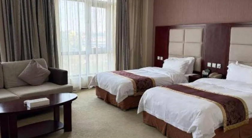 Bed in Xinxiang Zhongzhou Yihe Hotel