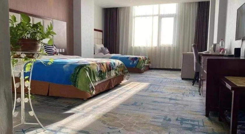 Bed in Xinxiang Zhongzhou Yihe Hotel