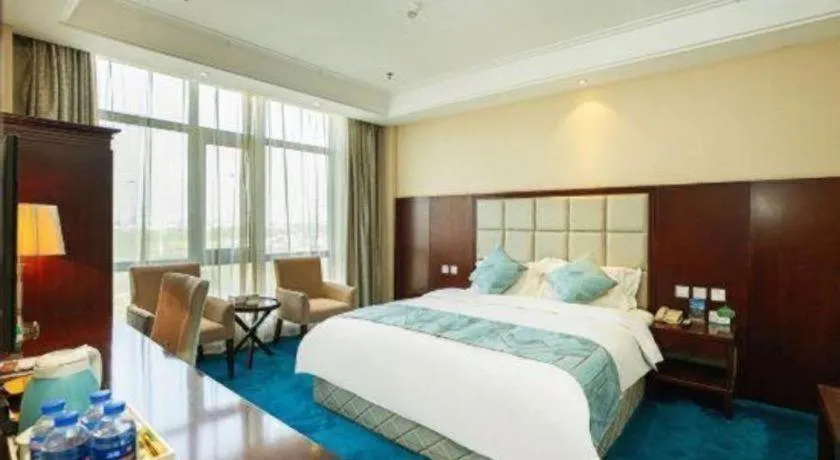 Bed in Xinxiang Zhongzhou Yihe Hotel