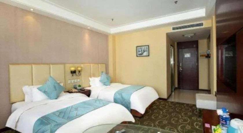 Bed in Xinxiang Zhongzhou Yihe Hotel