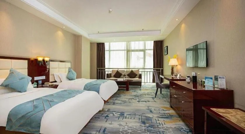 Bed in Xinxiang Zhongzhou Yihe Hotel