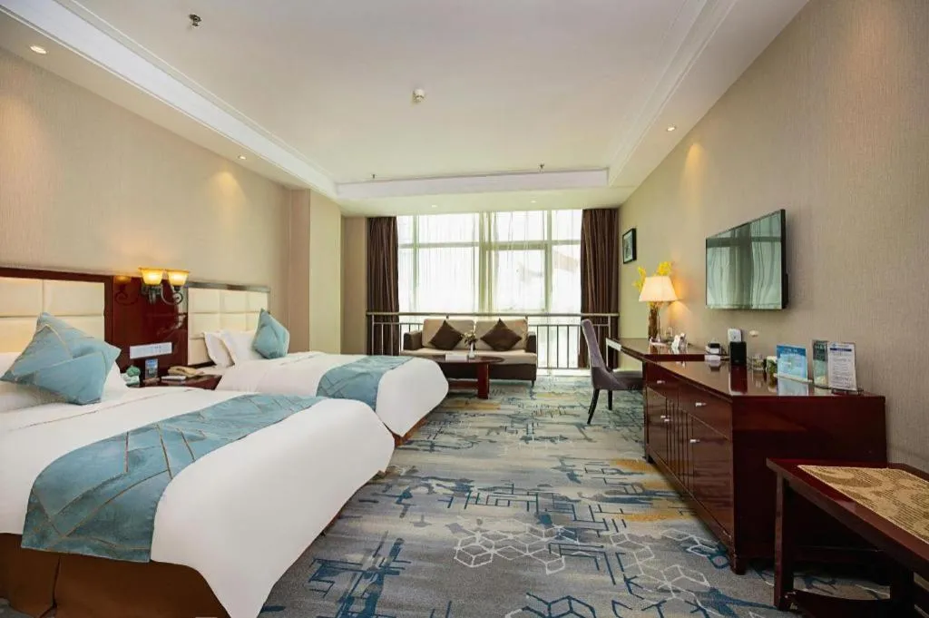 Bed in Xinxiang Zhongzhou Yihe Hotel