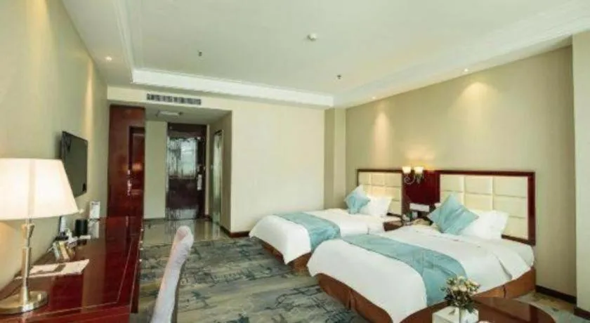 Bed in Xinxiang Zhongzhou Yihe Hotel