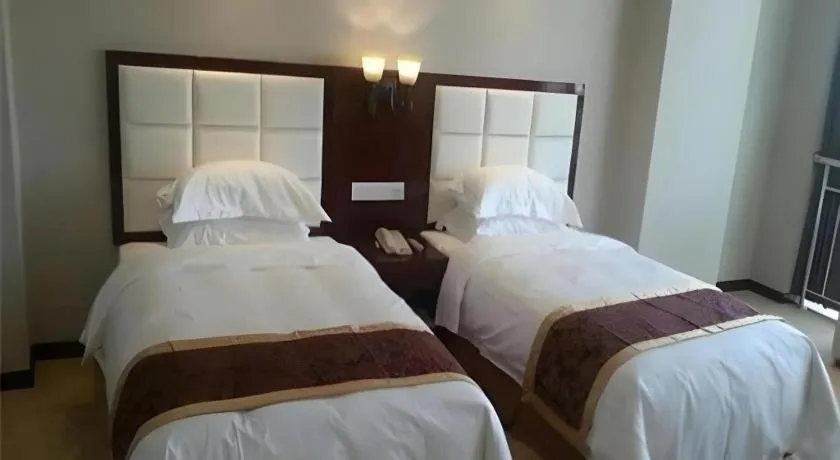 Bed in Xinxiang Zhongzhou Yihe Hotel