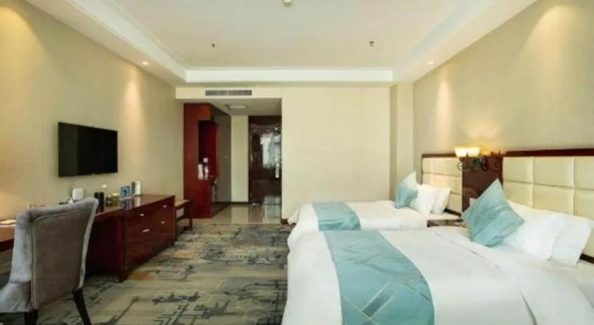 Bed in Xinxiang Zhongzhou Yihe Hotel
