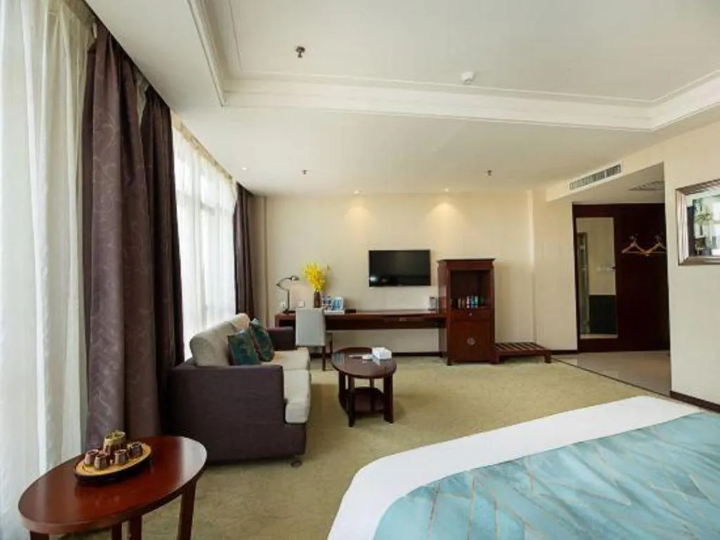 Bed in Xinxiang Zhongzhou Yihe Hotel