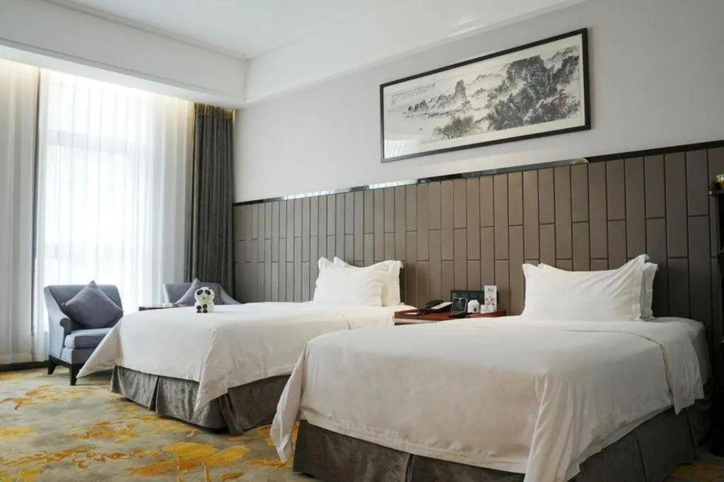 Bed in Jiyuan Oriental Jianguo Hotel