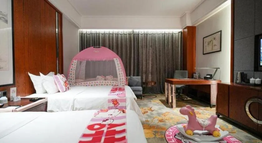 Bed in Jiyuan Oriental Jianguo Hotel