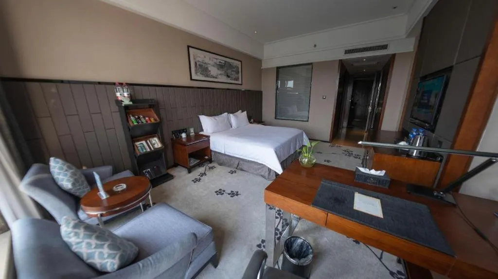 Bed in Jiyuan Oriental Jianguo Hotel