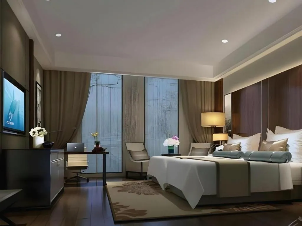 Bed in Jiyuan Oriental Jianguo Hotel