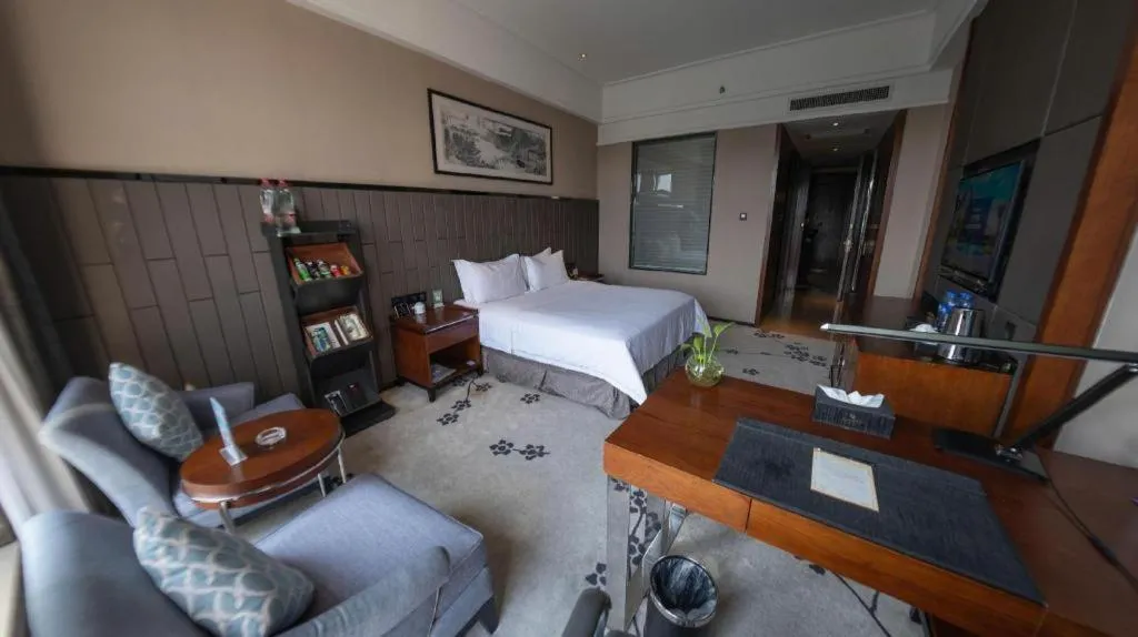 Bed in Jiyuan Oriental Jianguo Hotel