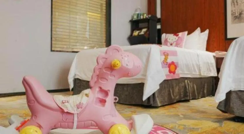 Bed in Jiyuan Oriental Jianguo Hotel