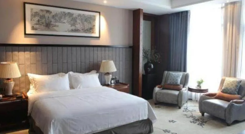 Bed in Jiyuan Oriental Jianguo Hotel