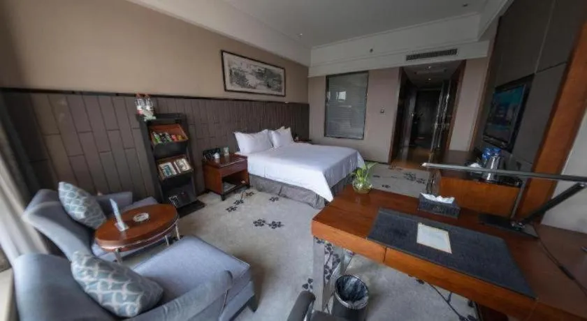 Bed in Jiyuan Oriental Jianguo Hotel