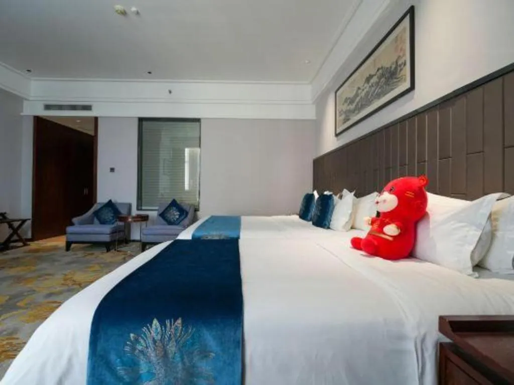 Bed in Jiyuan Oriental Jianguo Hotel