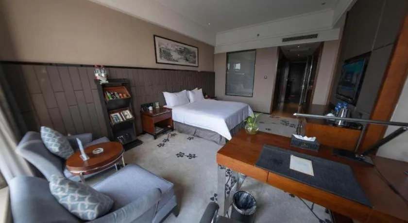 Bed in Jiyuan Oriental Jianguo Hotel