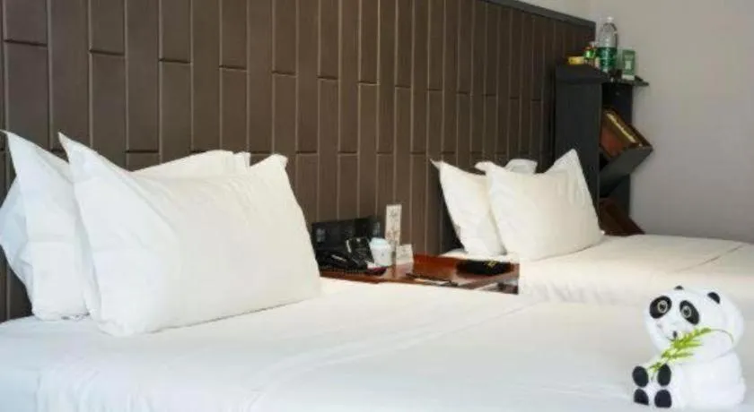 Bed in Jiyuan Oriental Jianguo Hotel