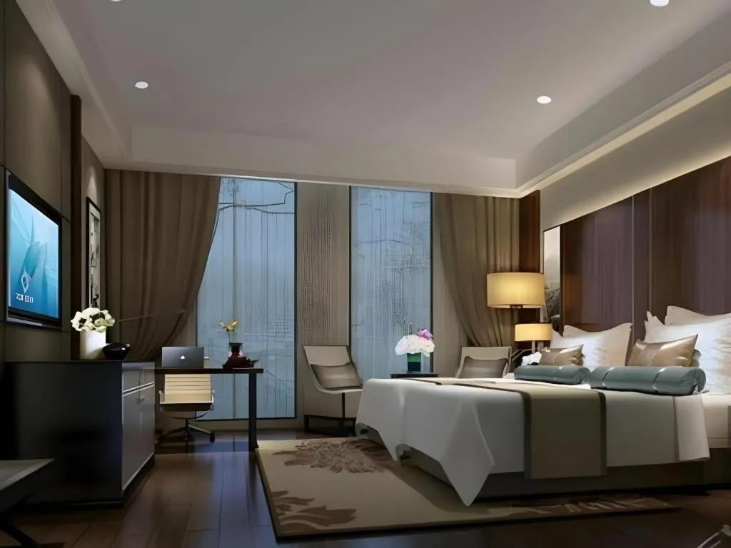 Bed in Jiyuan Oriental Jianguo Hotel