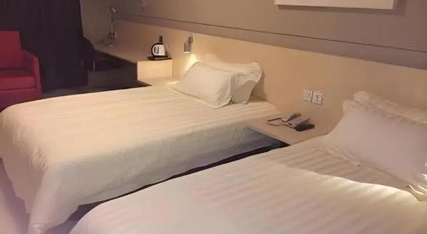 Bed in Jinjiang Inn Tai Zhou Xinghua Yingwu Bridge Branch Bed in Jinjiang Inn Tai Zhou Xinghua Yingwu Bridge Branch